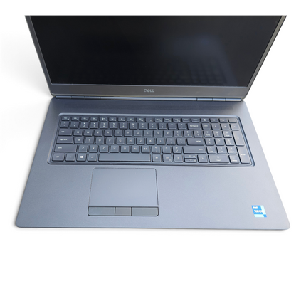 The Computer Market Dell Precision 7760 17.3-inch mobile workstation laptop in grey with a full keyboard and trackpad.