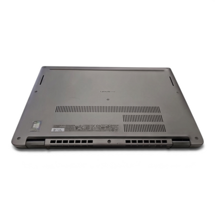 The Computer Market Dell Latitude 5320 laptop shown from the bottom view, featuring ventilation grilles and branding.