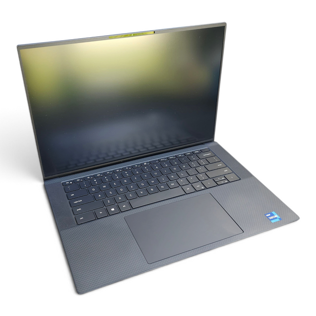 The Computer Market Dell Precision 5560 laptop with a 15.6-inch screen, black keyboard, and Intel Xeon processor label.