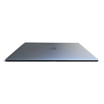 The Computer Market Dell Precision 5550 laptop in silver, closed view showing the sleek metallic lid and Dell logo.