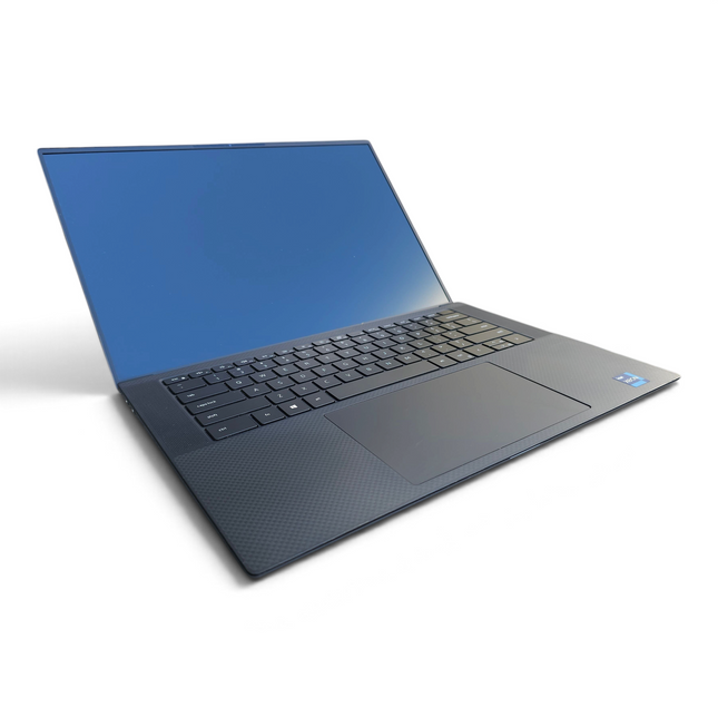 The Computer Market Dell Precision 5560 laptop with a 15.6-inch screen, black chassis, and Intel Xeon processor.