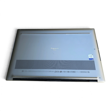The Computer Market refurbished silver Dell Precision 5550 laptop, bottom view showing vents and product label.