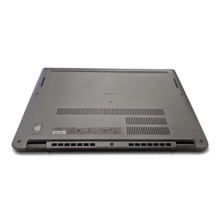 The Computer Market Dell Latitude 5320 laptop shown from the base, featuring ventilation grilles and product labels.
